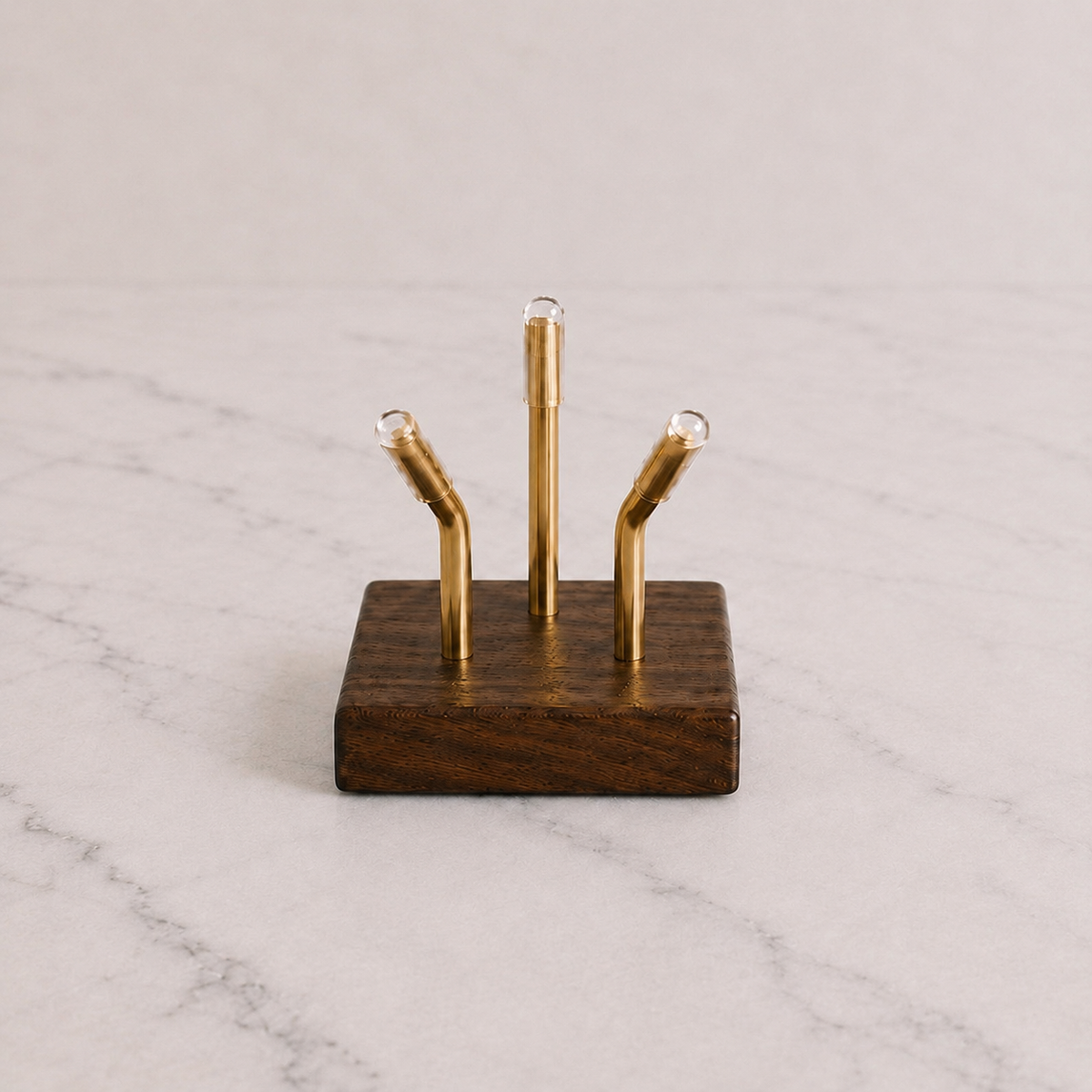Walnut Sculptural Pedestal with brass mounting posts on marble