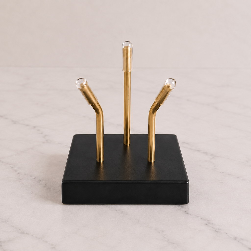 Black Sculptural Pedestal with brass mounting posts, close-up view
